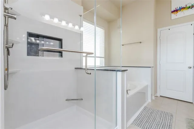 a bathroom with a bathtub and a window