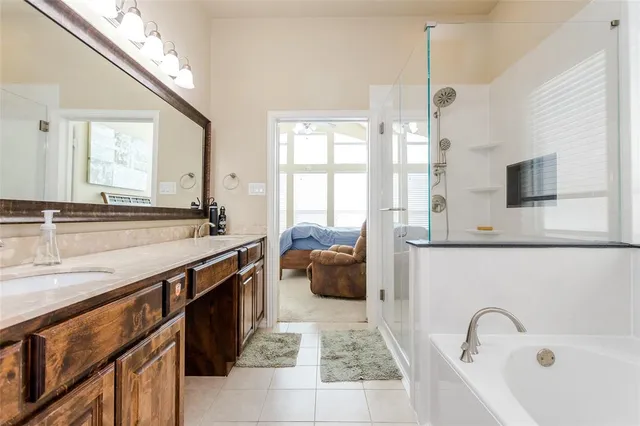 a spacious bathroom with a sink double vanity and a mirror