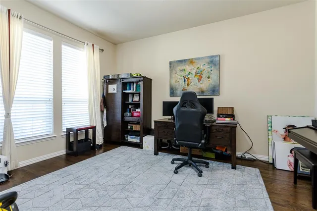 a workspace with furniture and a window