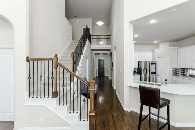 a view of a hallway with furniture and entryway
