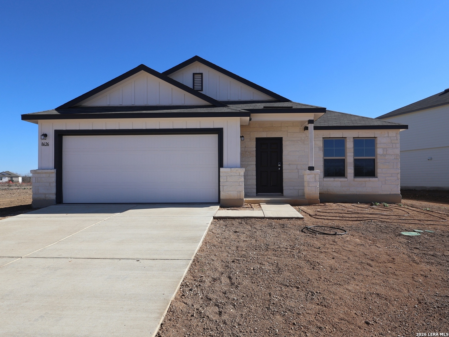8626 Rucker Pond Trail San Antonio, TX 78252 - Photo 1 of 24 a front view of a house with a yard and garage