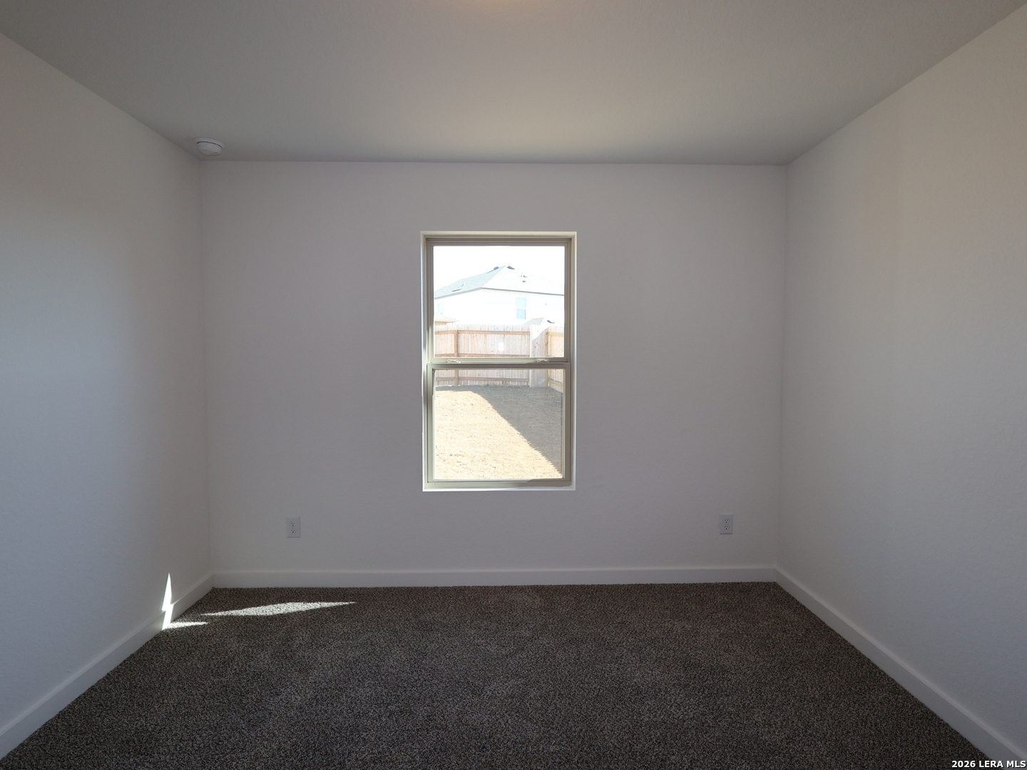 8626 Rucker Pond Trail San Antonio, TX 78252 - Photo 14 of 24 an empty room with a window