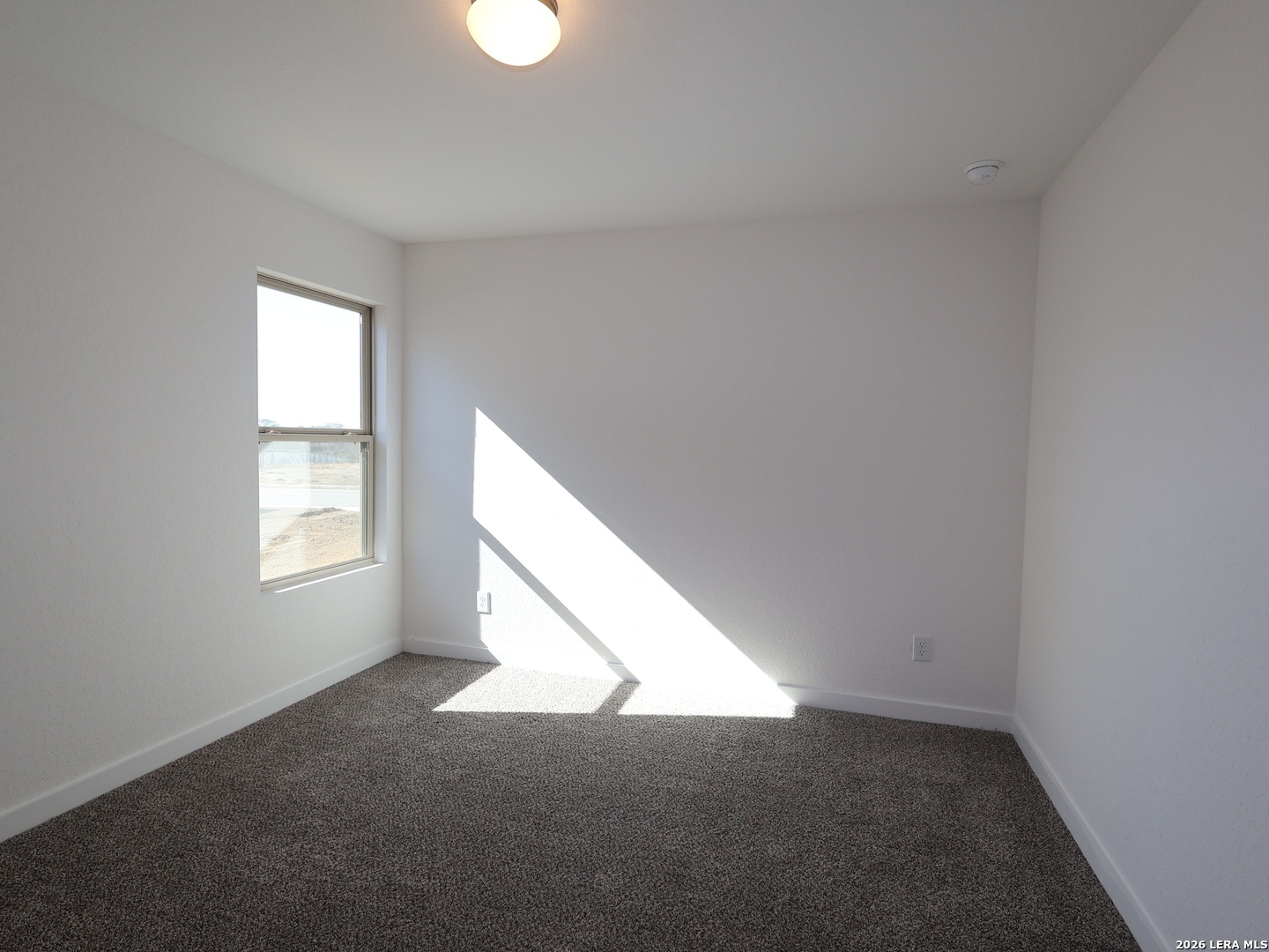 8626 Rucker Pond Trail San Antonio, TX 78252 - Photo 17 of 24 a view of an empty room and window