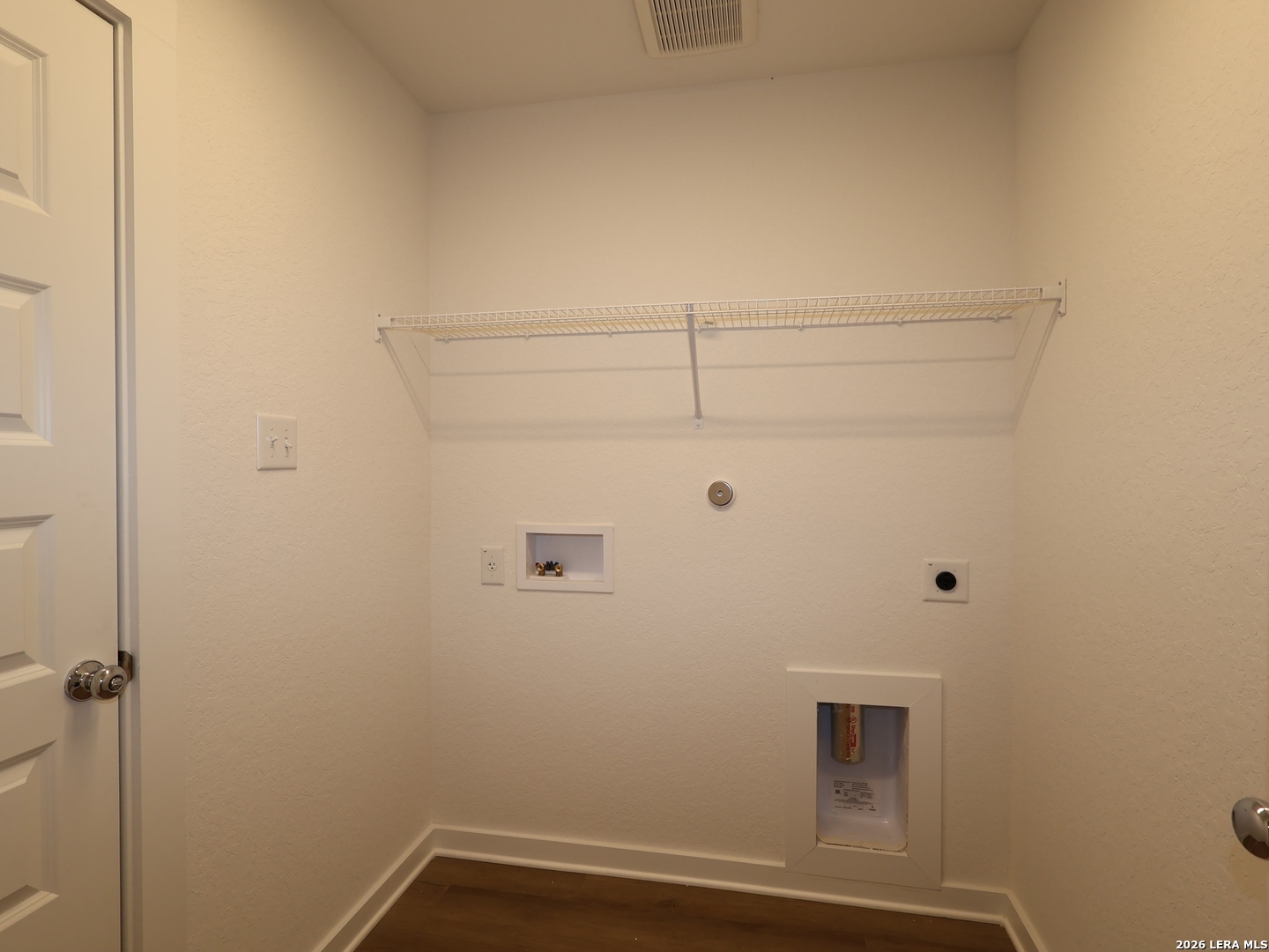 8626 Rucker Pond Trail San Antonio, TX 78252 - Photo 19 of 24 a view of small space with racks on the wall