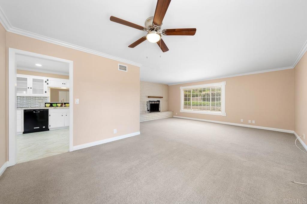 2073 Valley Rim Road El Cajon, CA 92019 - Photo 2 of 20 an empty room with windows and a ceiling fan