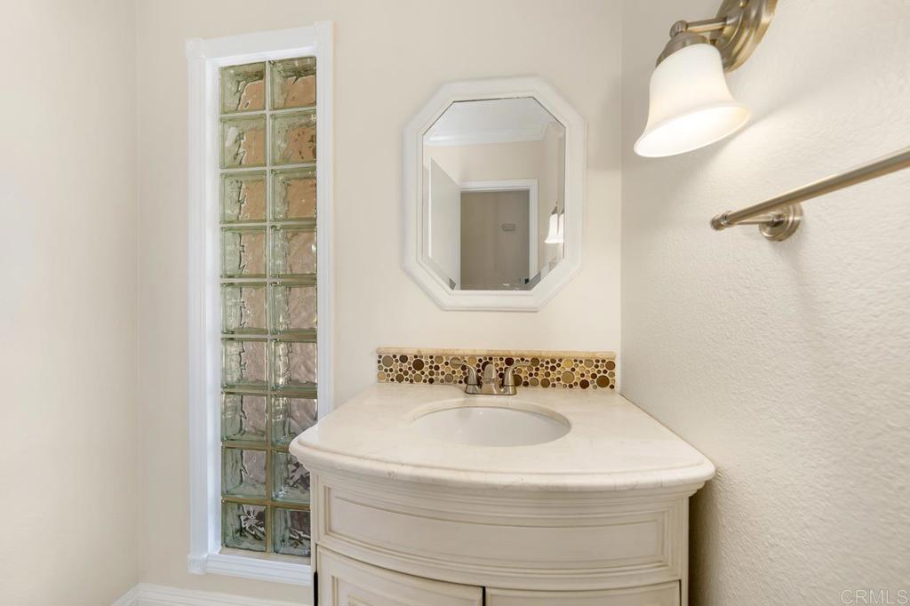2073 Valley Rim Road El Cajon, CA 92019 - Photo 7 of 20 a bathroom with a sink and a mirror