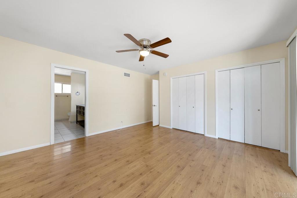 2073 Valley Rim Road El Cajon, CA 92019 - Photo 9 of 20 a view of a livingroom with a ceiling fan & hardwood floor