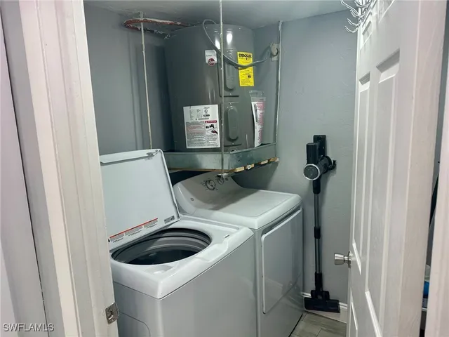 a bathroom with a sink and washing machine