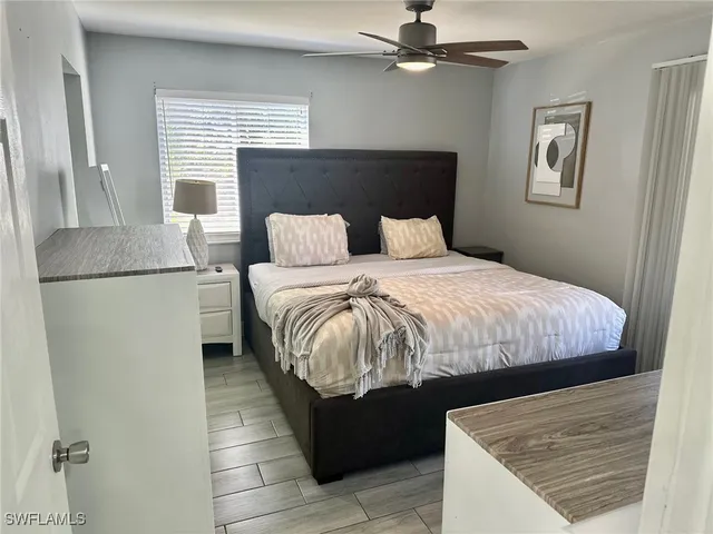 a bedroom with a bed and window