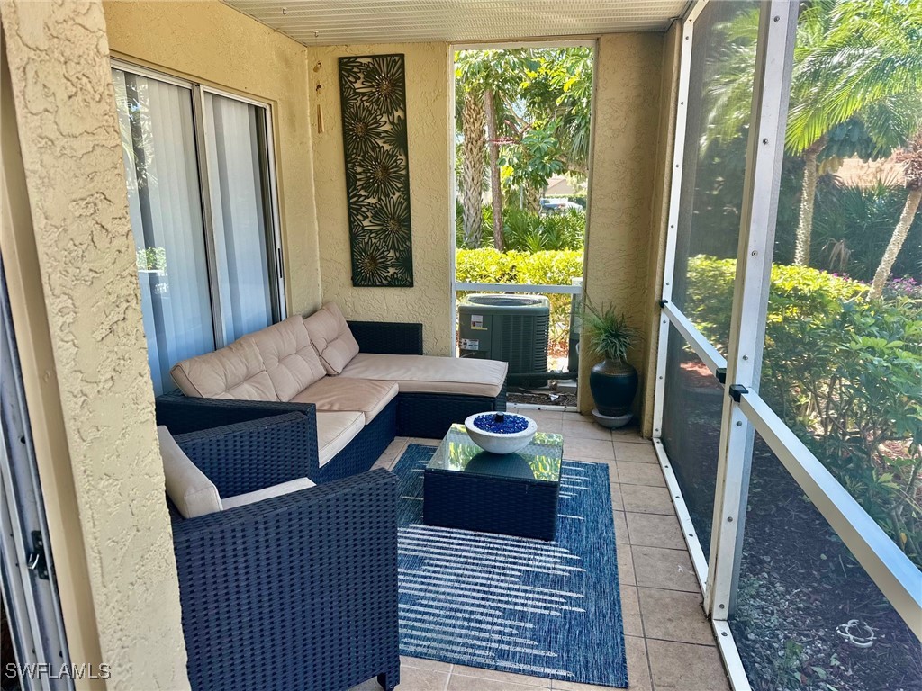 3100 Seasons Way, Unit 108 Estero, FL 33928 - Photo 18 of 40 a living room with furniture and a large window