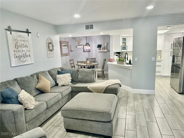 a living room with furniture and a rug