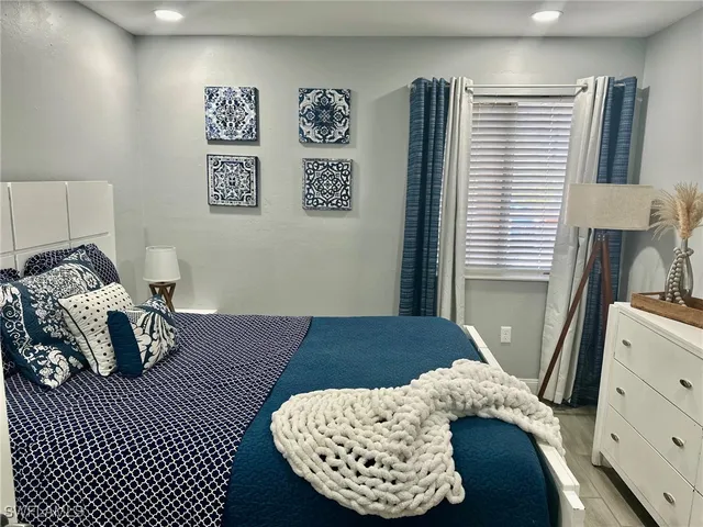 a bedroom with a bed and a dresser