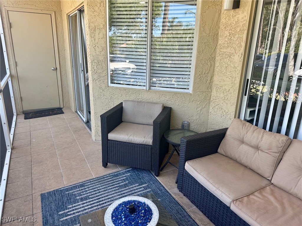 3100 Seasons Way, Unit 108 Estero, FL 33928 - Photo 6 of 40 a living room with furniture and a window