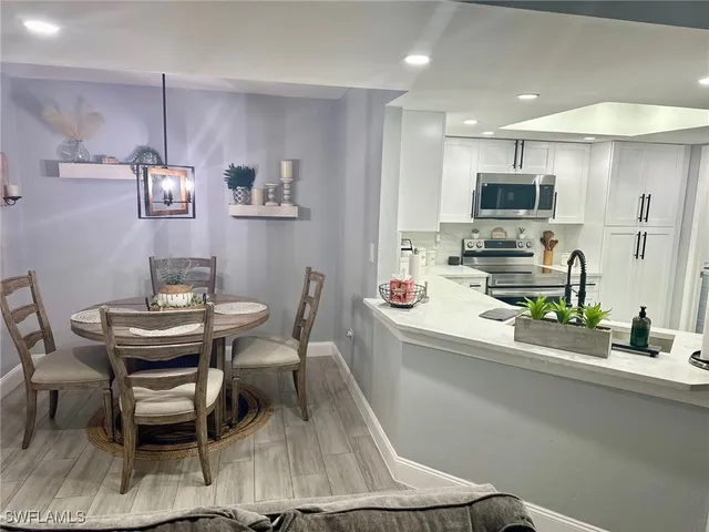 a dining room with furniture and window