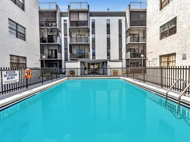 a view of a swimming pool with a patio