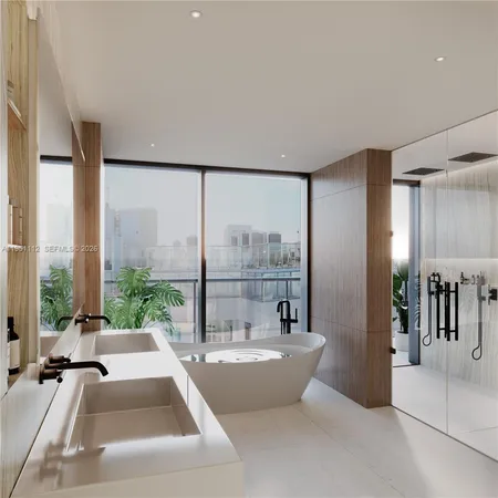 a bathroom with a large tub and shower
