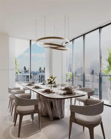 a dining room with furniture and window