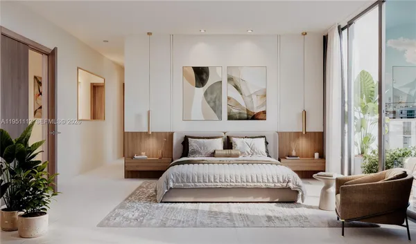 a bedroom with a large bed and a couch