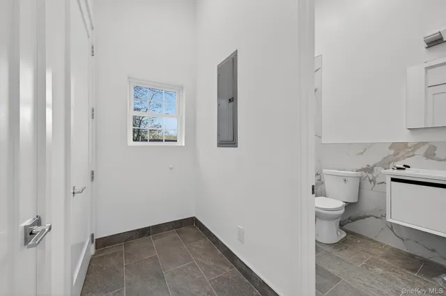 a bathroom with a toilet and a sink