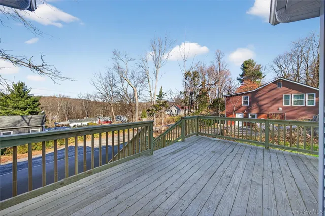 a view of a balcony with wooden floor