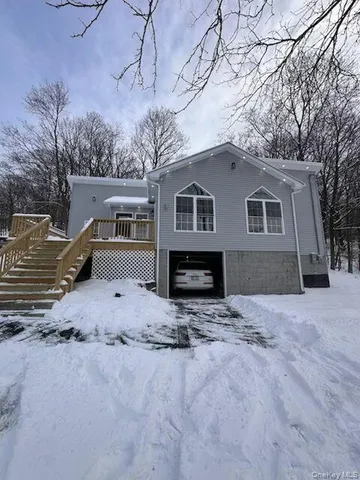 a house with trees in the background