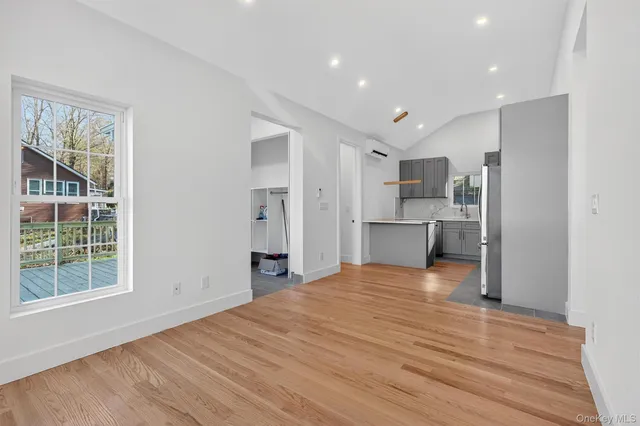 a view of a kitchen with a sink and dishwasher refrigerator