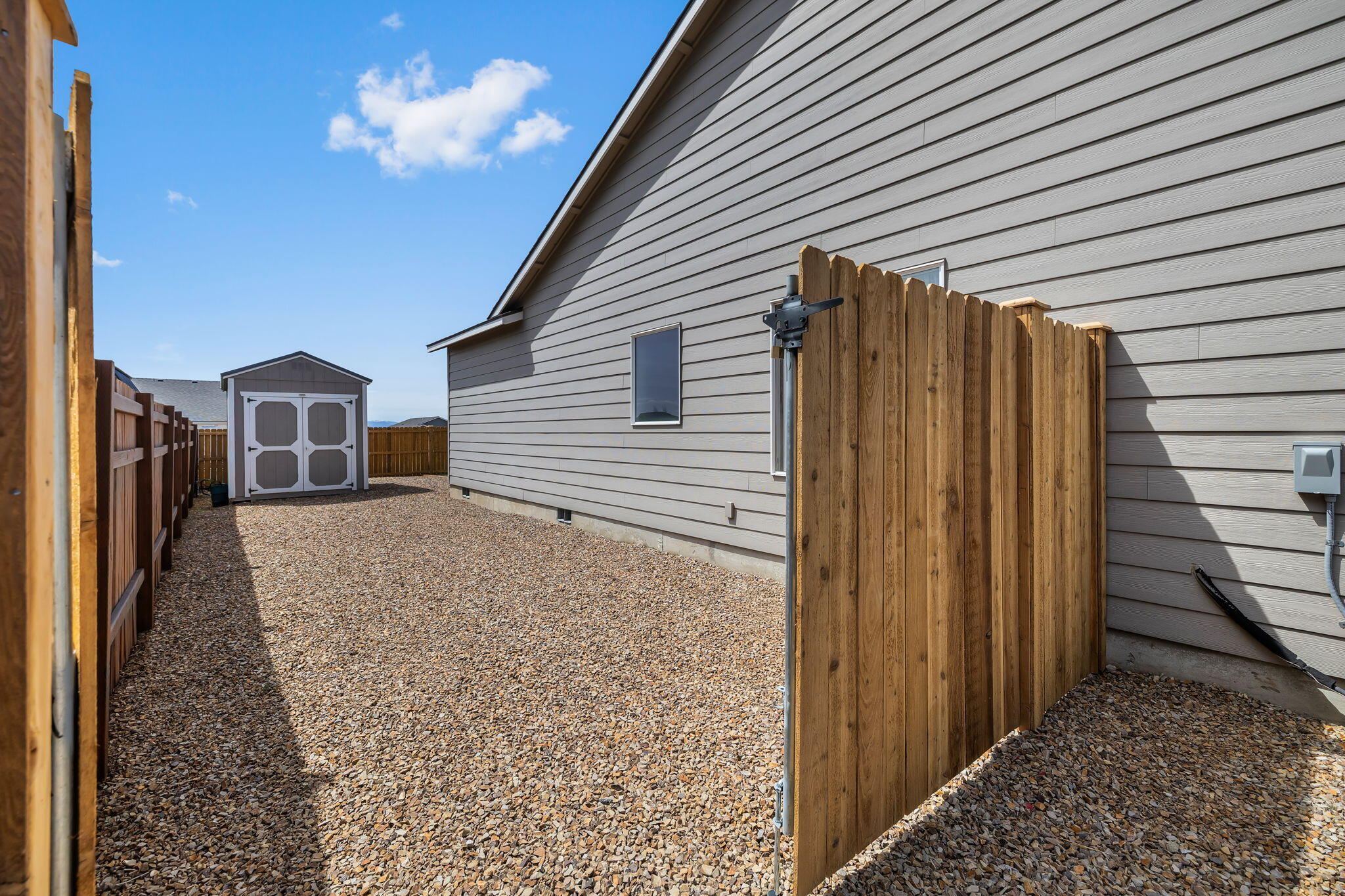 1132 Northwest Golf Course Drive Madras, OR 97741 - Photo 26 of 36 a view of a house with a backyard