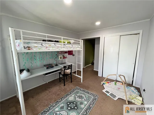 a room with furniture and gym equipment