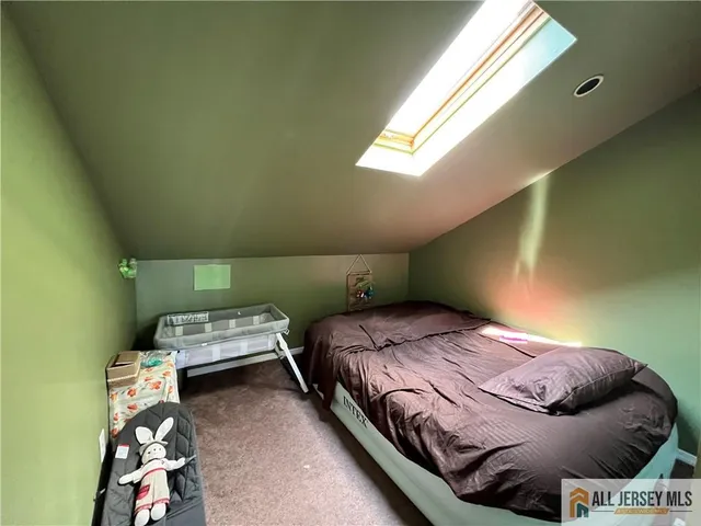 a room with a bed and a window