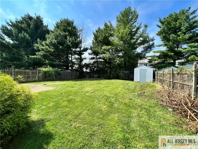 a view of a house with a back yard