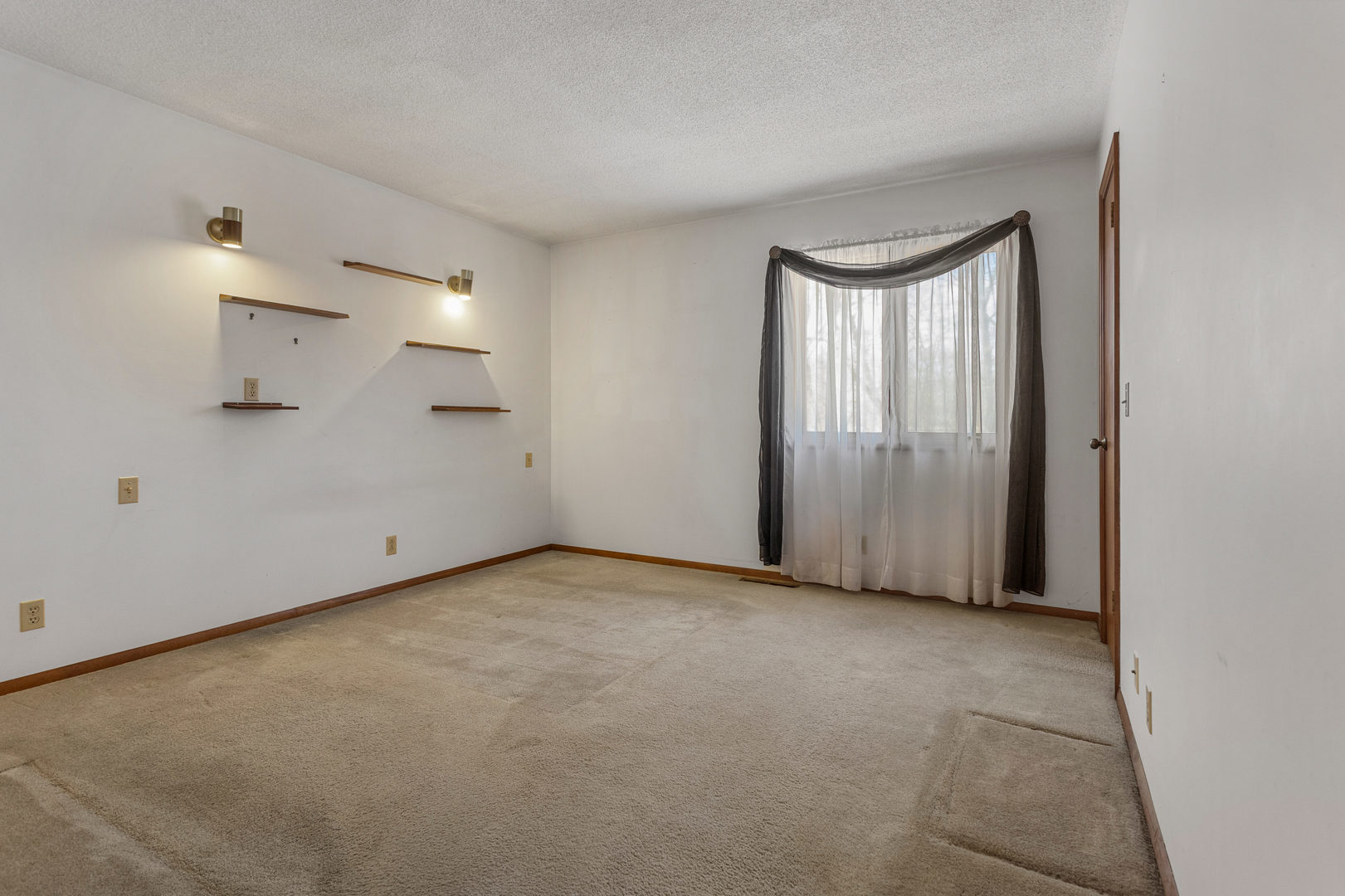 614 South Irving Street Monticello, IL 61856 - Photo 17 of 36 a view of an empty room and window