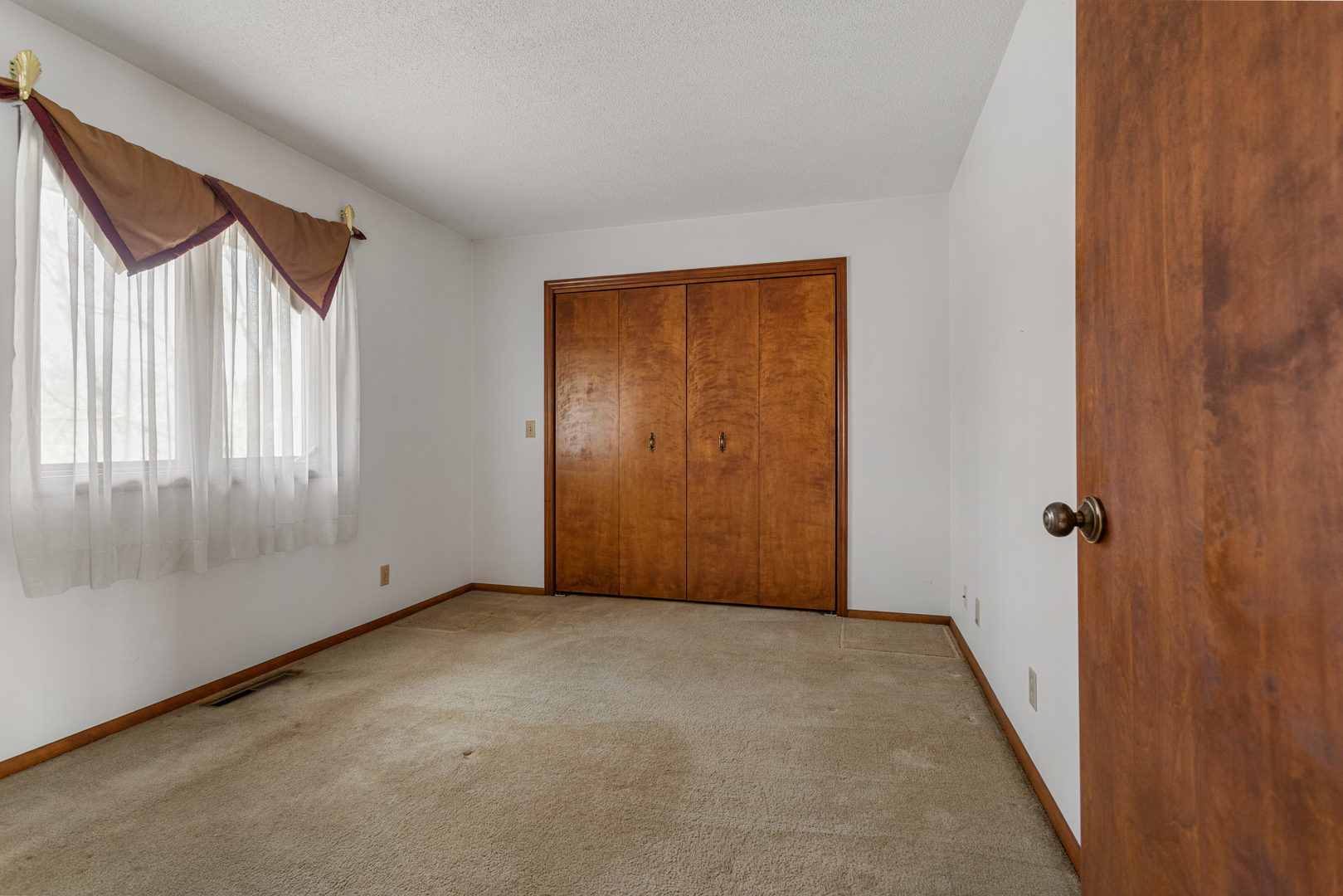 614 South Irving Street Monticello, IL 61856 - Photo 18 of 36 a view of an empty room with a window