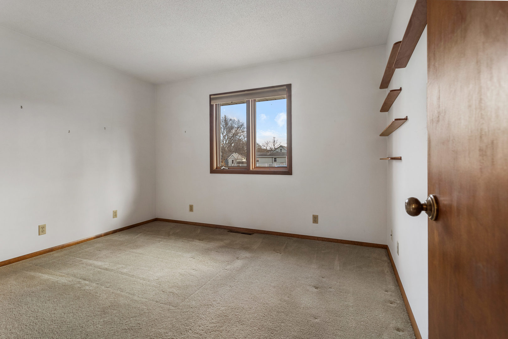614 South Irving Street Monticello, IL 61856 - Photo 22 of 36 a view of an empty room with a window