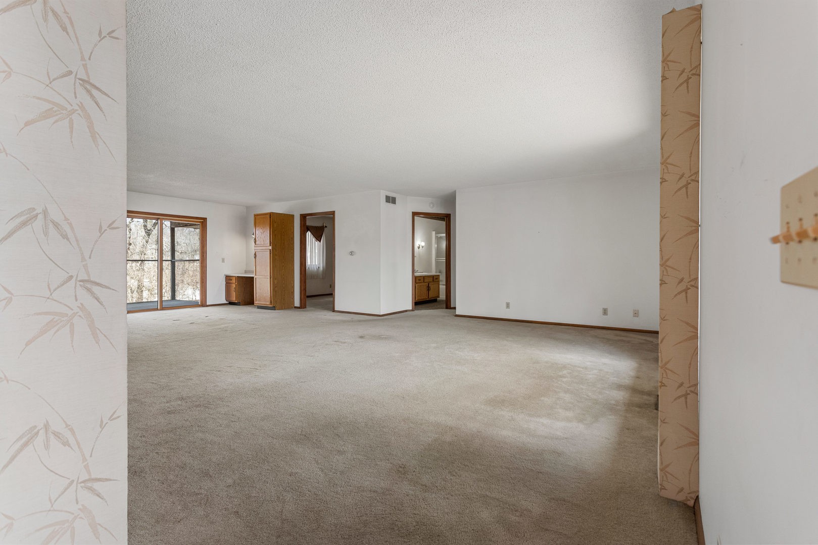 614 South Irving Street Monticello, IL 61856 - Photo 4 of 36 a view of empty room with windows