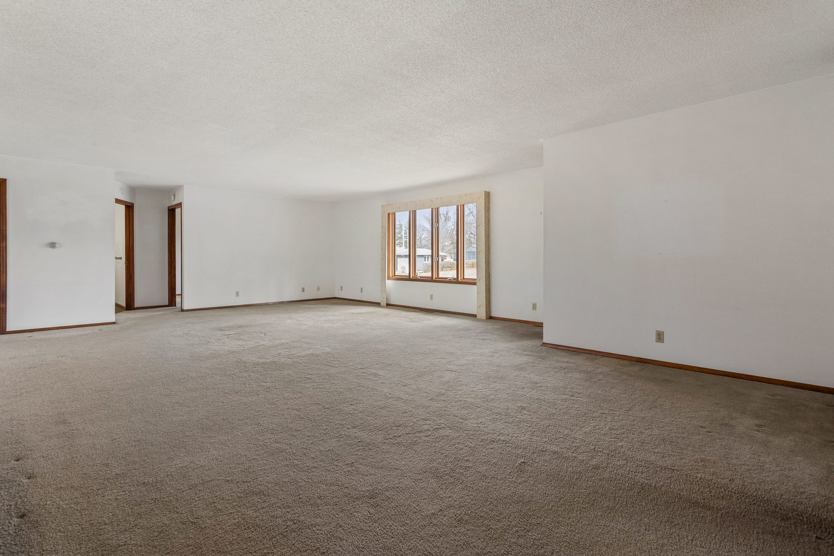614 South Irving Street Monticello, IL 61856 - Photo 5 of 36 a view of an empty room with a window