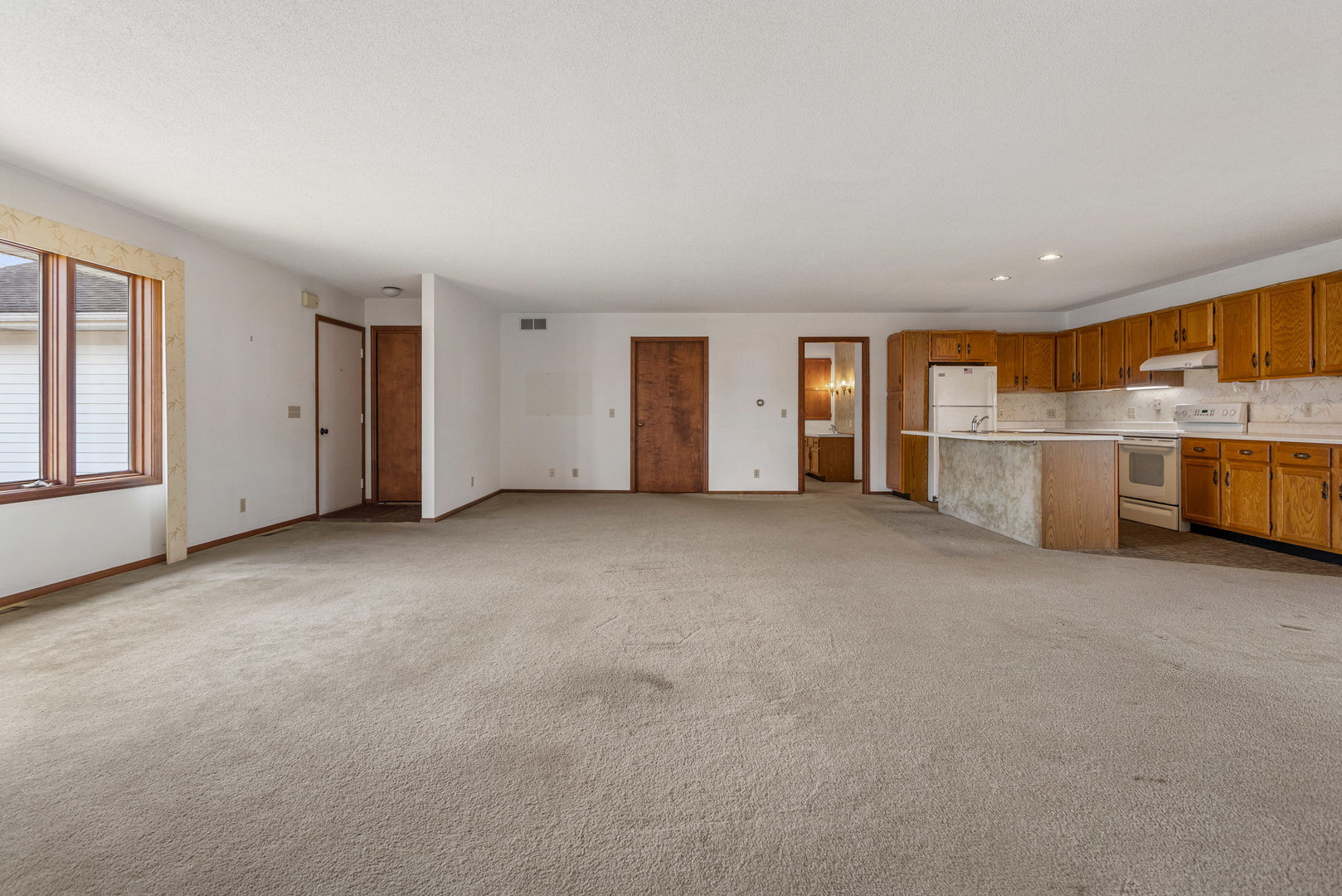 614 South Irving Street Monticello, IL 61856 - Photo 6 of 36 a view of a livingroom with an empty space and a window