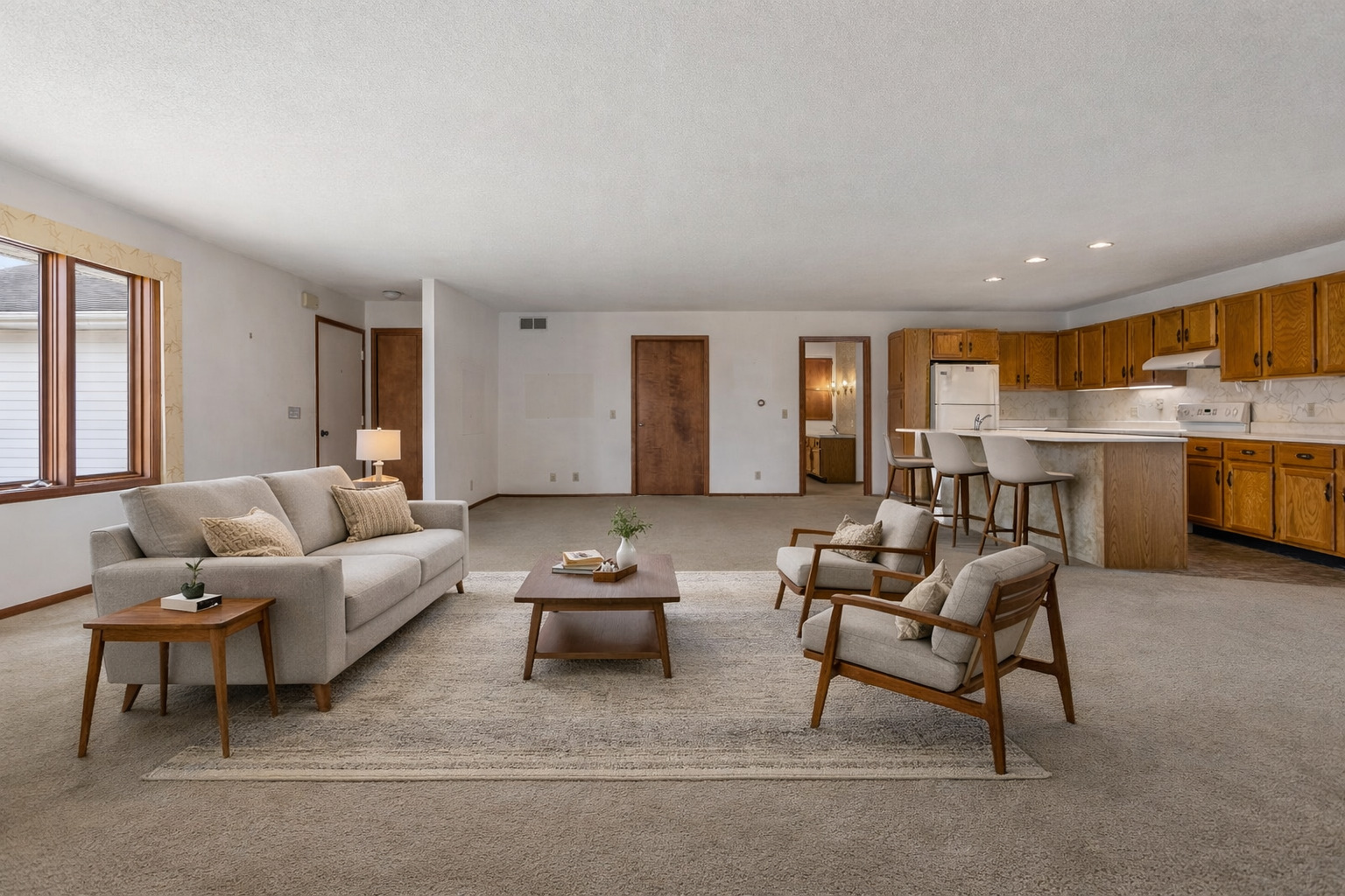 614 South Irving Street Monticello, IL 61856 - Photo 7 of 36 a living room with furniture a fireplace and a large window