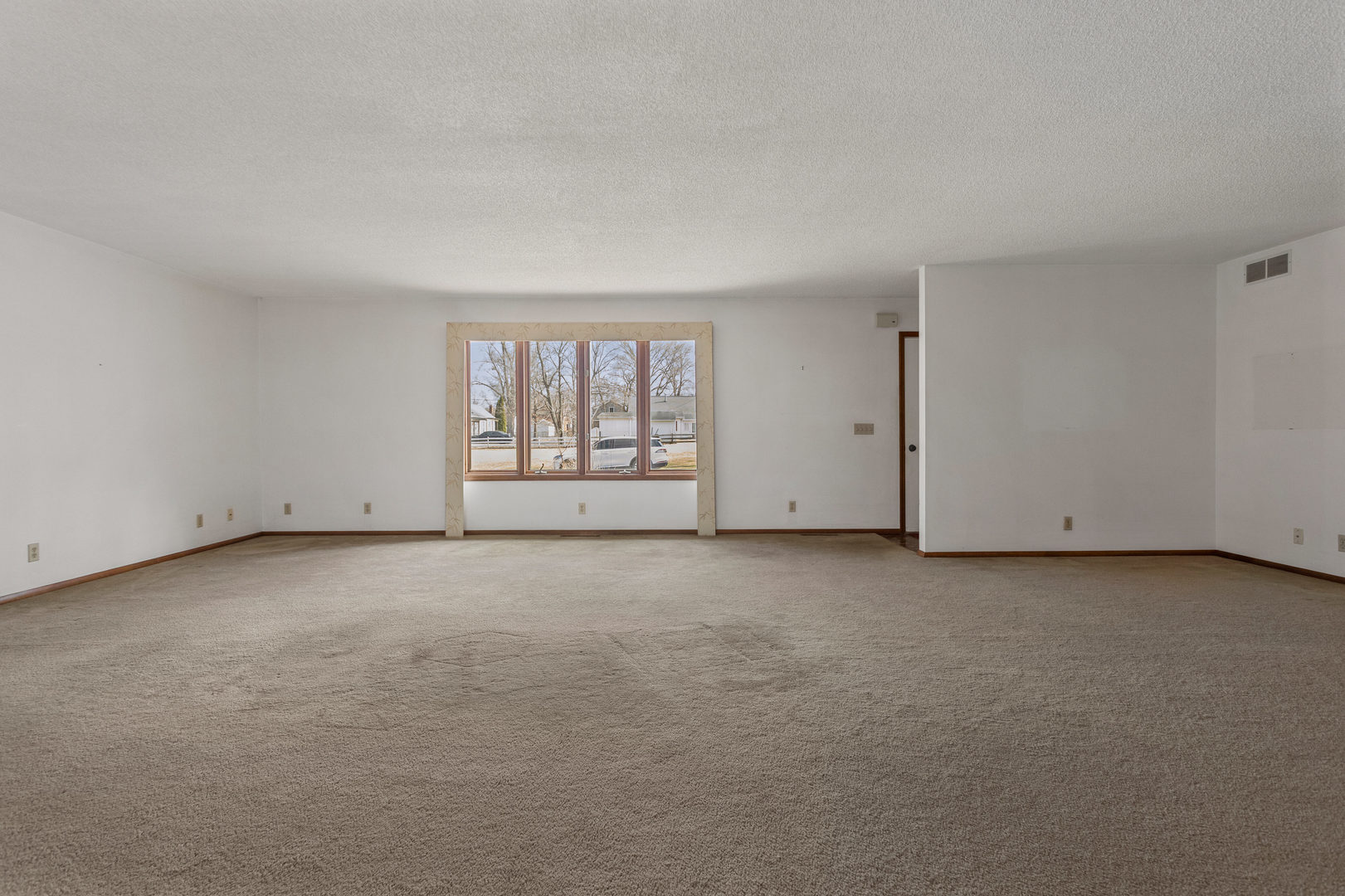 614 South Irving Street Monticello, IL 61856 - Photo 8 of 36 an empty room with a empty space and windows