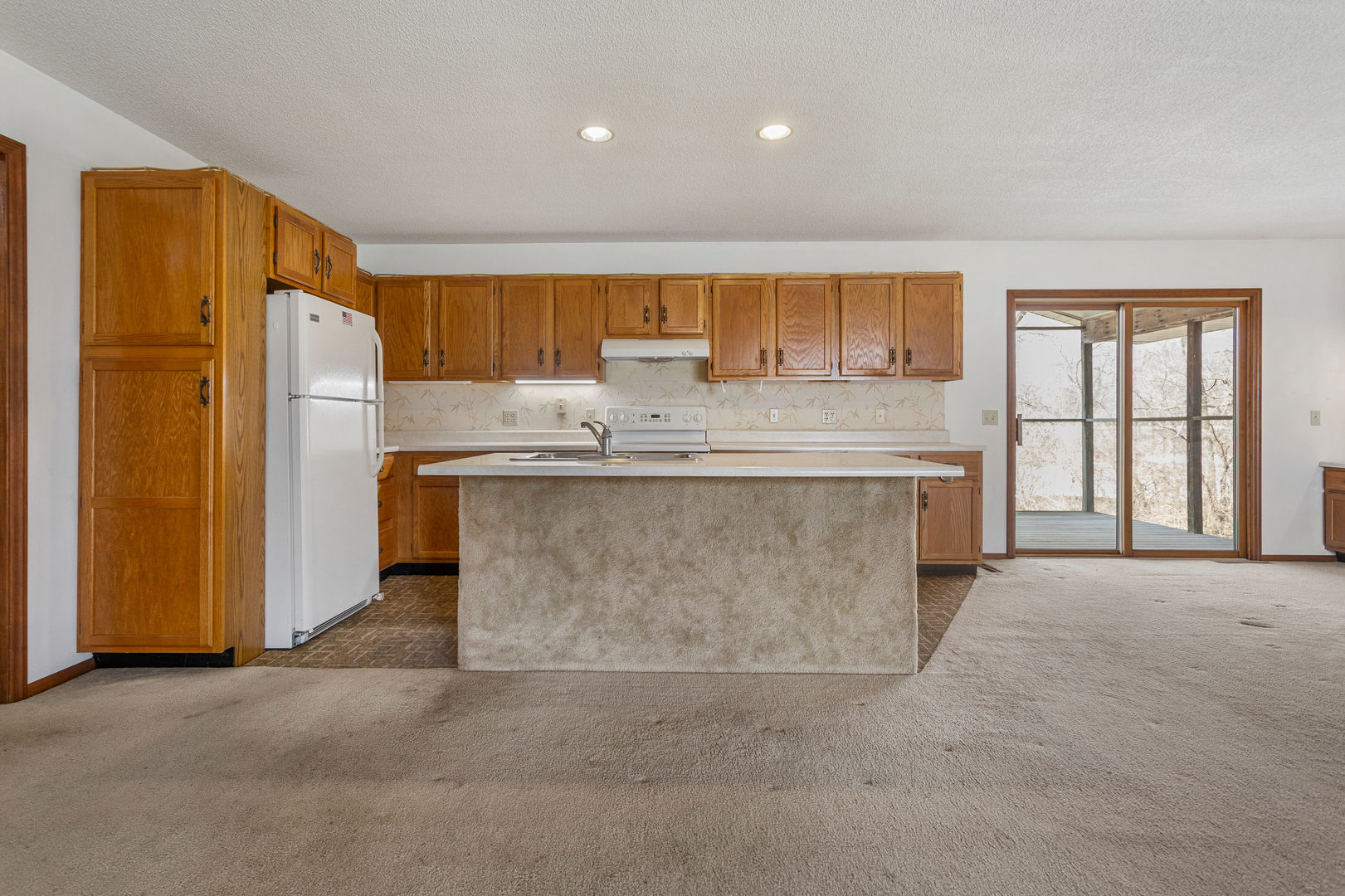 614 South Irving Street Monticello, IL 61856 - Photo 10 of 36 a kitchen with stainless steel appliances granite countertop a sink stove and refrigerator
