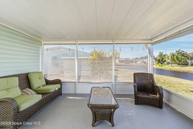 a reading room with furniture and a window