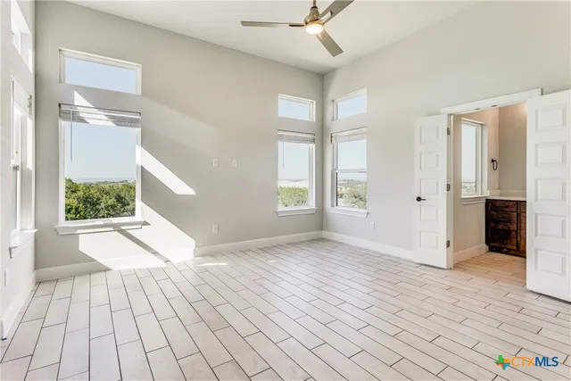 a view of an empty room with a window
