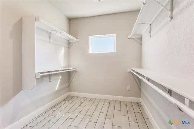 a view of an empty walk in closet