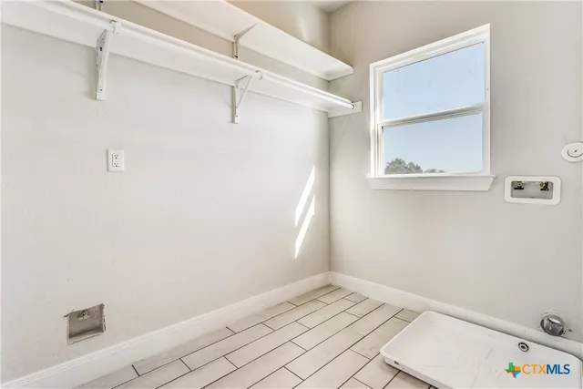 a view of a room with racks on the wall