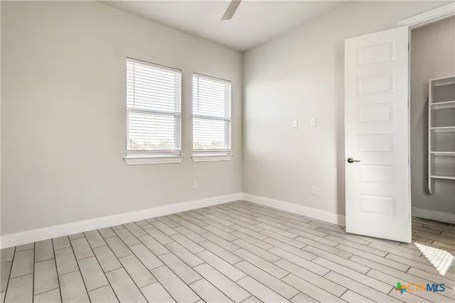 an empty room with windows