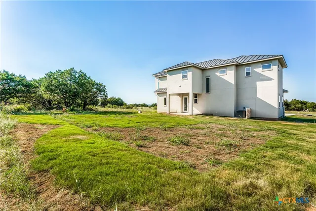 a house view with a outdoor space