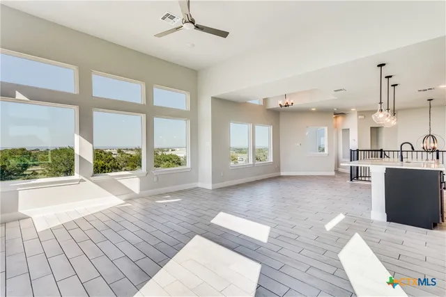 a view of a living room and a balcony