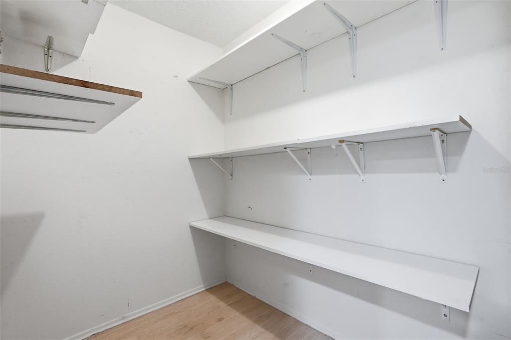 6415 Midnight Pass Road, Unit 211 Sarasota, FL 34242 - Photo 17 of 58 a view of an empty walk in closet