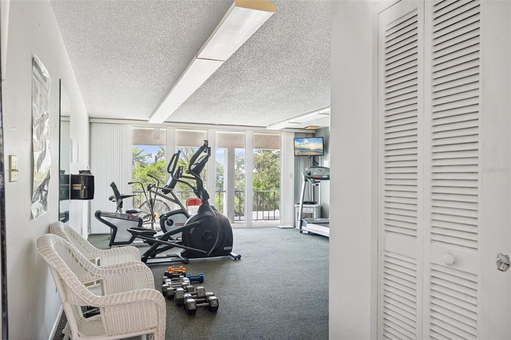 6415 Midnight Pass Road, Unit 211 Sarasota, FL 34242 - Photo 41 of 58 a view of a workspace with furniture and a window