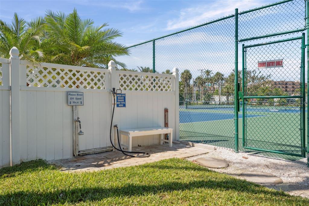 6415 Midnight Pass Road, Unit 211 Sarasota, FL 34242 - Photo 43 of 58 a backyard of a house with plants and outdoor seating