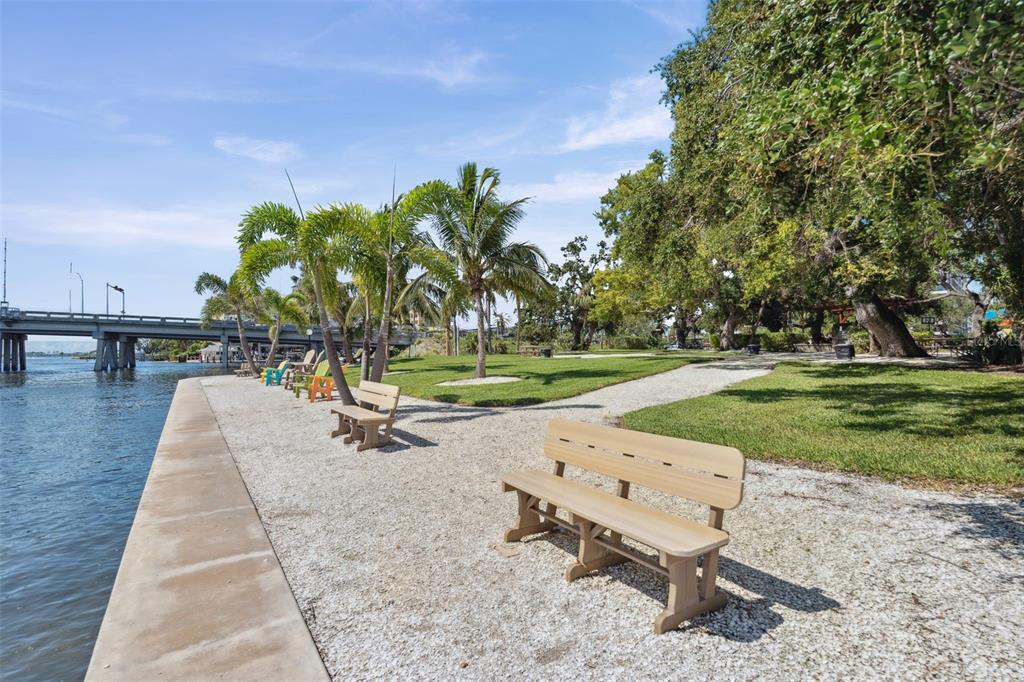 6415 Midnight Pass Road, Unit 211 Sarasota, FL 34242 - Photo 51 of 58 an outdoor space with seating